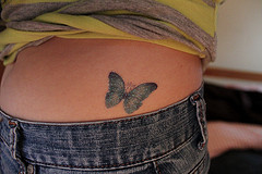 tattoo on woman's lower back